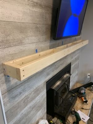 diy floating mantel 2x4 support attached to the wall