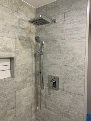 dumawall tile installation with rain showerhead