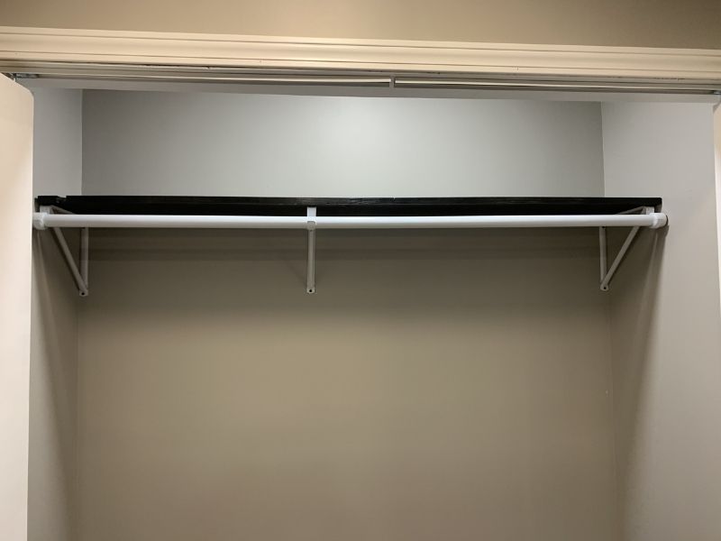 add the closet rod to the shelf brackets