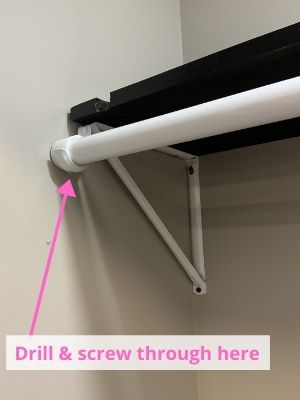 drill and screw to secure closet rod in place