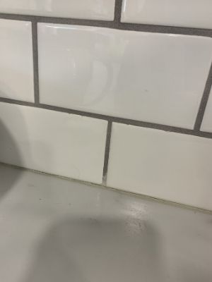 tape before caulking subway tile backsplash