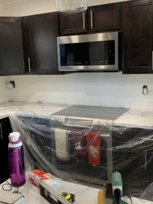 install subway tile backsplash with a drop cloth