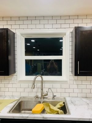 finished subway tile backsplash around a window