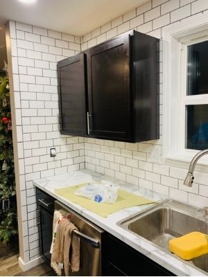 floor to ceiling subway tile backsplash