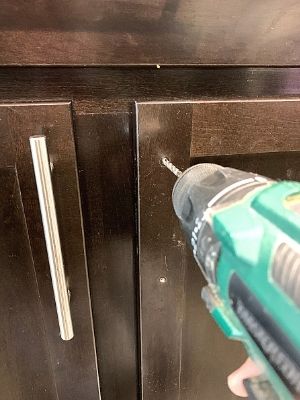 how to install kitchen handles on cabinets drill through cabinet