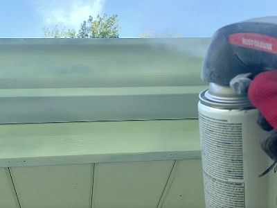 how to paint gutters downspouts - spray second coat of paint