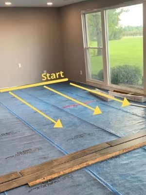 how to install underlayment laminate flooring concrete - start on one wall