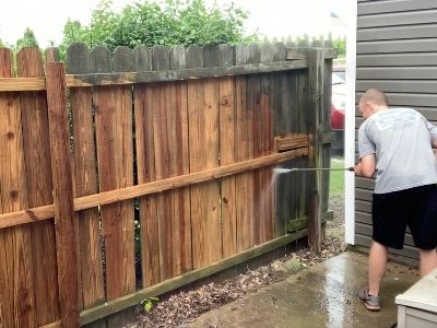 how to clean a wood fence before staining - cleaned fence