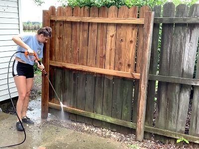 how to clean a wood fence before staining - hold the pressure washer spray 12-18 inches away from the fence