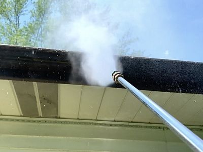 how to clean gutters with pressure washer - hold nozzle 12-18 inches away while spraying