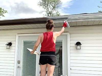 how to paint gutters downspouts - spray thin coats of paint on gutters
