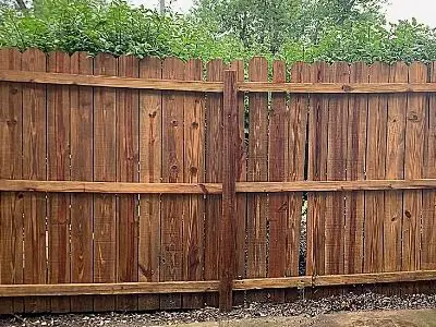 how to clean a wood fence before staining - fully pressure washed fence