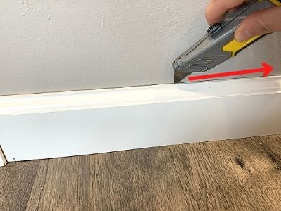 can you slide laminate flooring under baseboards