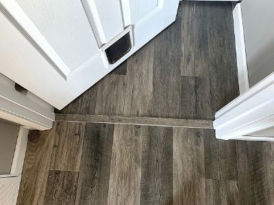 laminate floor transition strip placement in doorway example